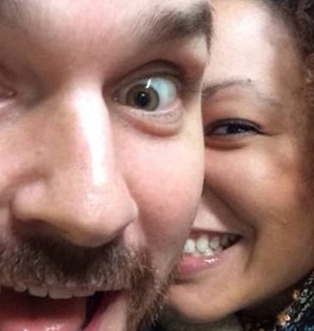 A close up happy picture of a happy white male and black female who have formed a successful interracial dating relationship